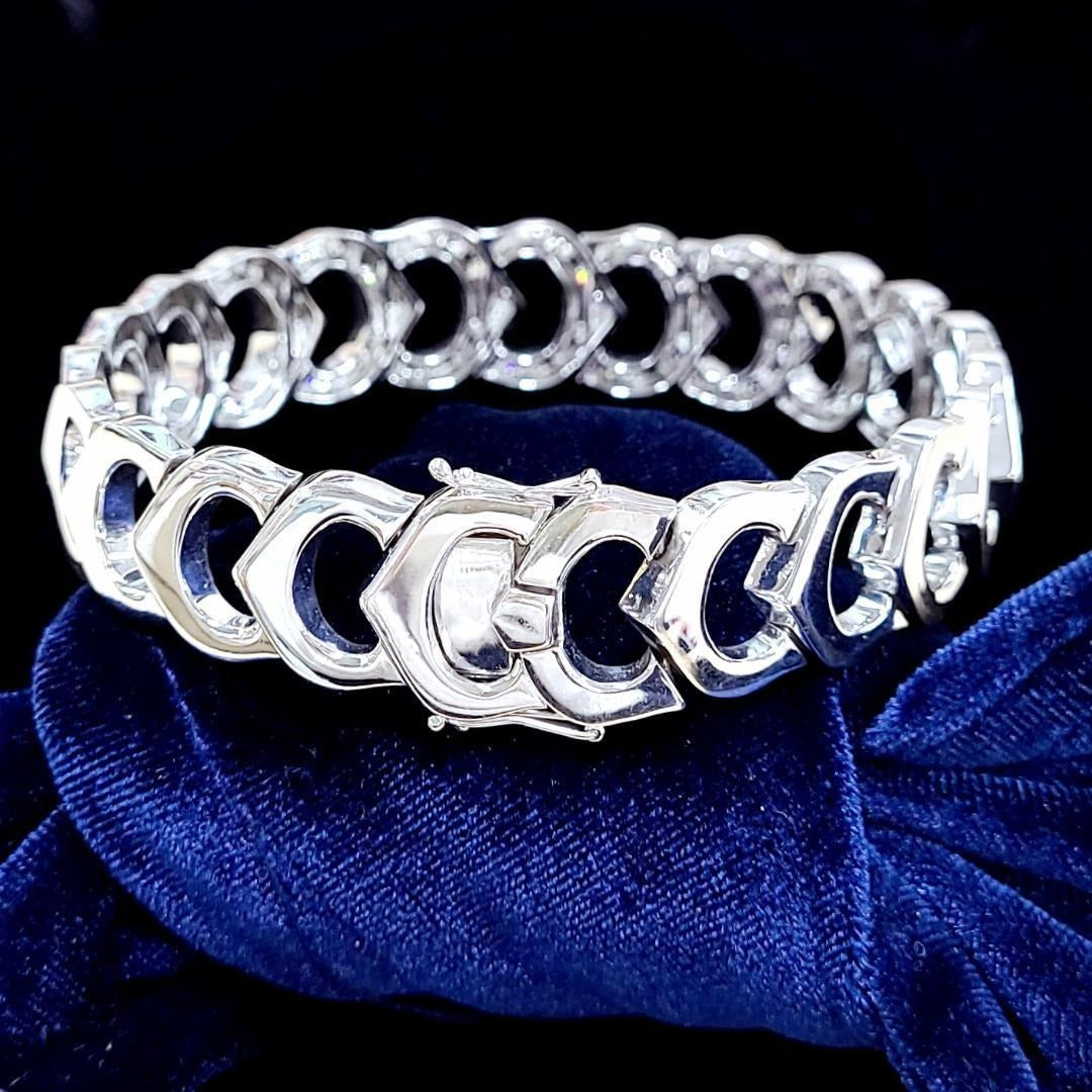 The supreme brilliance of 1.63ct natural diamonds, width 15mm, 46.42g, massive K18WG design bracelet [with identification report].