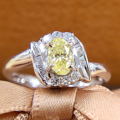 Fancy yellow diamond oval Pt900 platinum ring with April birthstone certificate from Central Gem Laboratory
